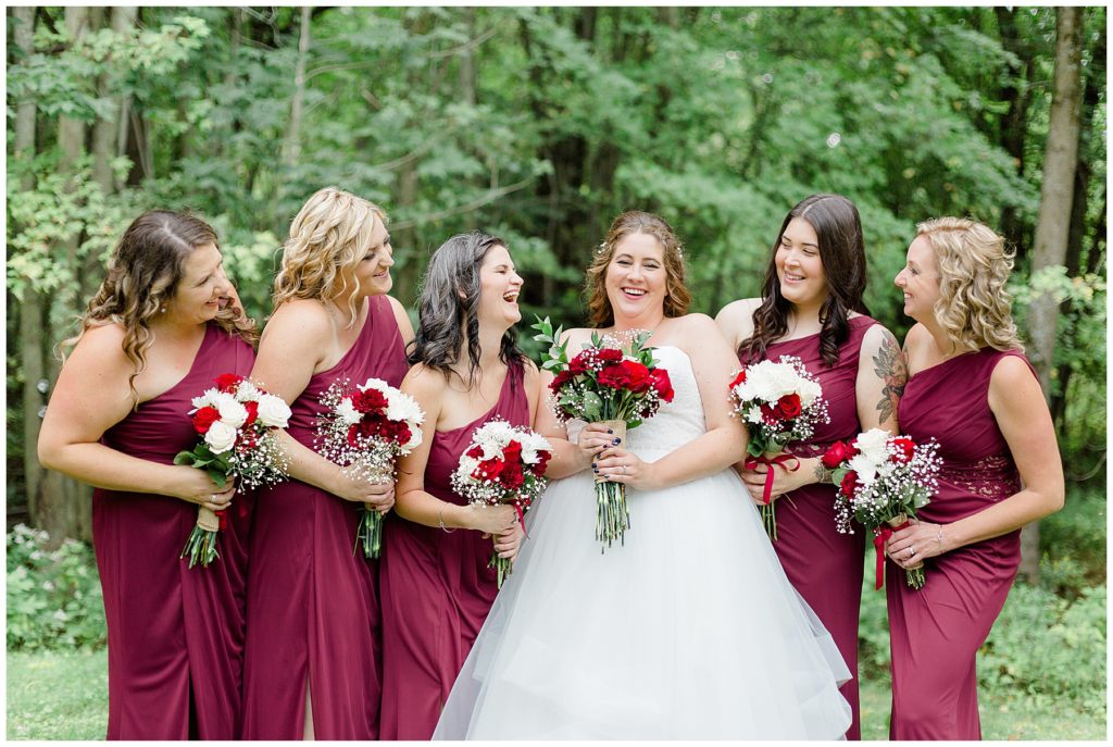 bride and bridesmaids wearing burgundy at carleton place wedding