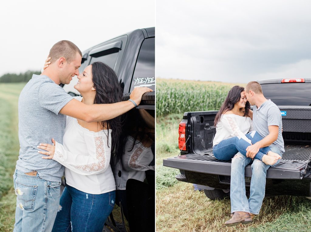 couple cuddling up in his pick up truck for engagement session