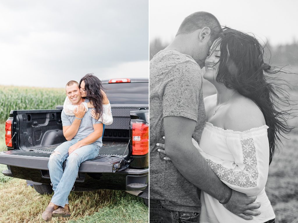 couple cuddling up in the rain in the middle of their engagement session