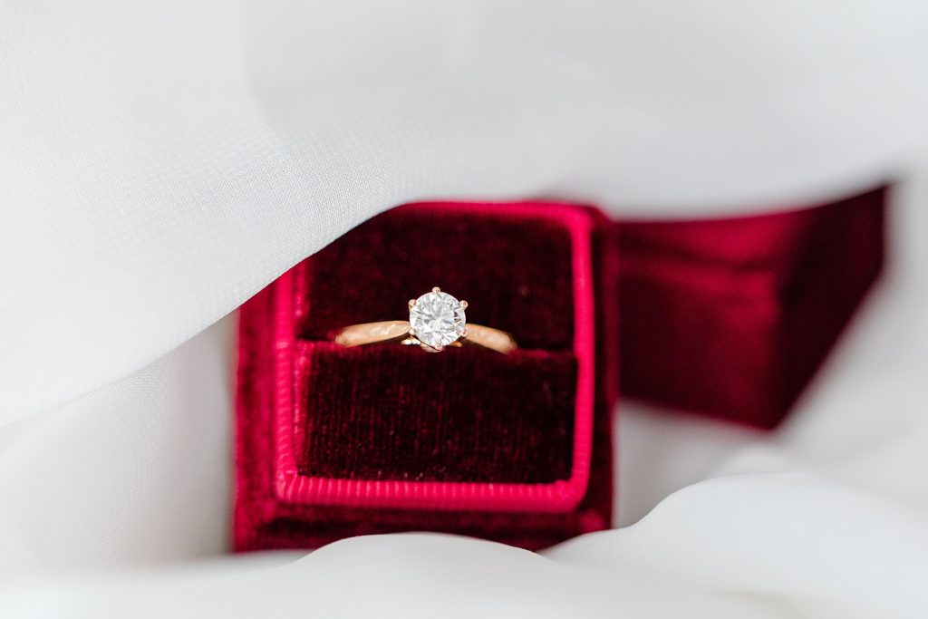 Engagement ring from Farrah Fine Jewellers inside of a burgundy Mrs. Box