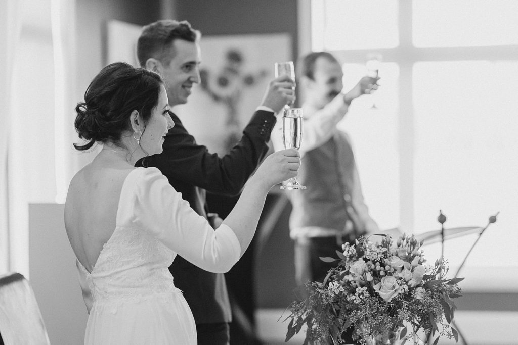 Bride and Groom having a champagne toast to start off their brunch reception at NeXT Restaurant