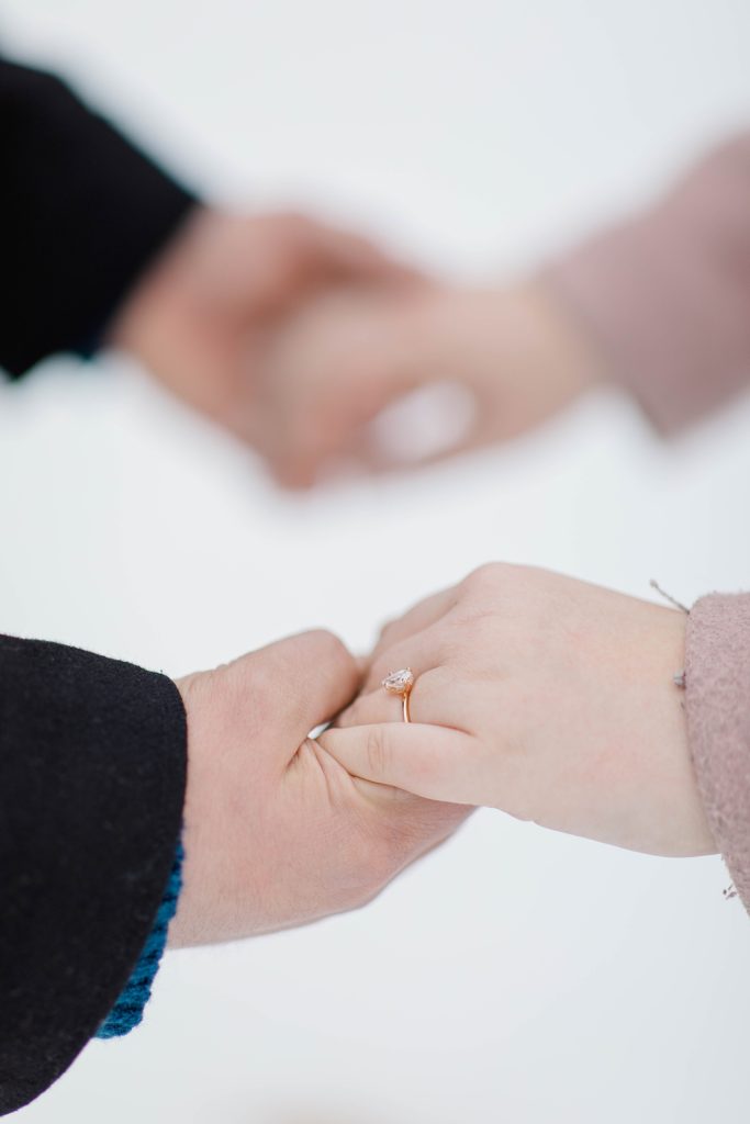 engagement ring photo of hands being held