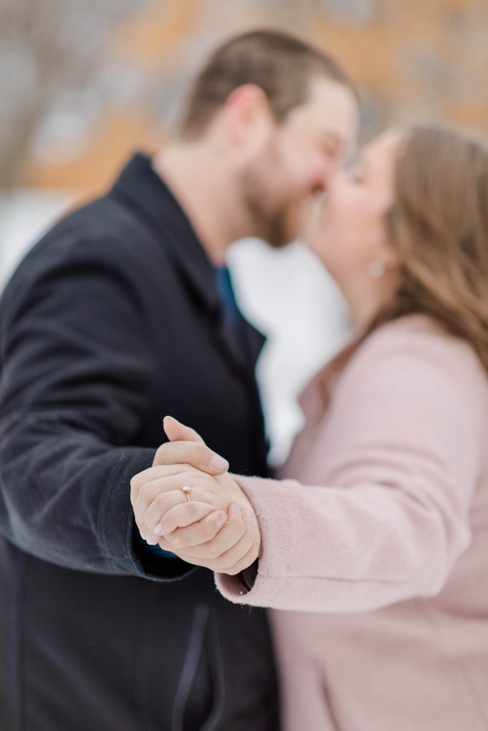 couples kissing at engagement session