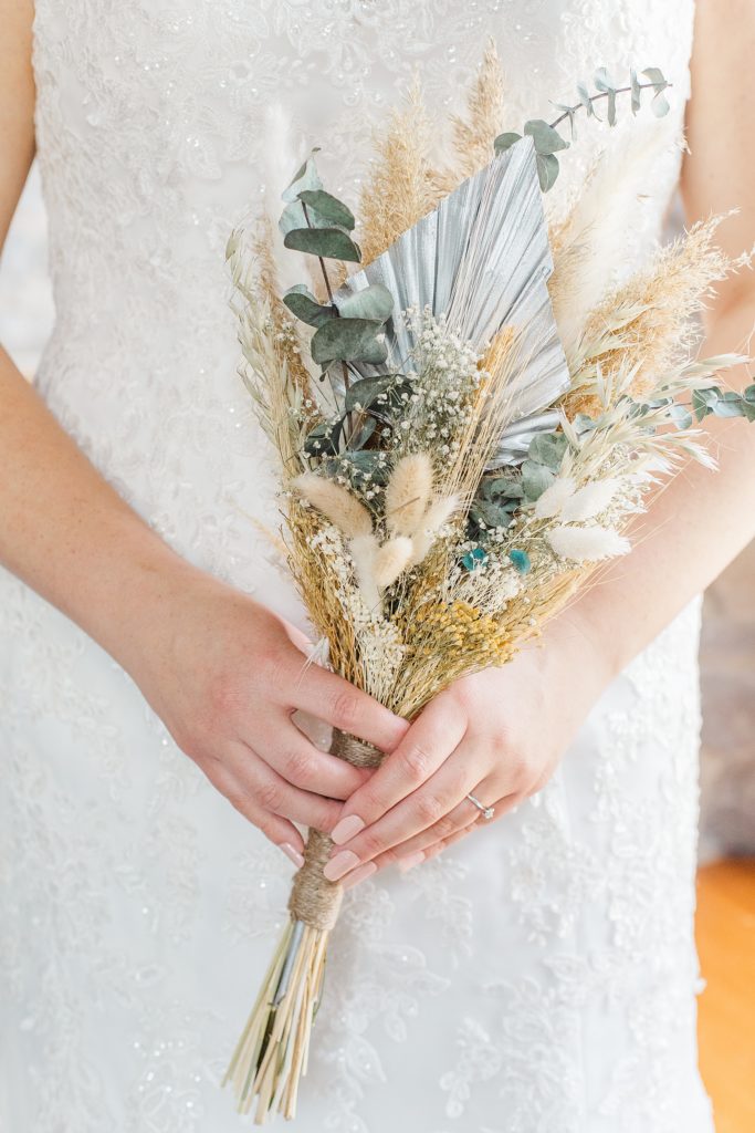 bride holding her dried floral bouquet made by 9th line farmhouse