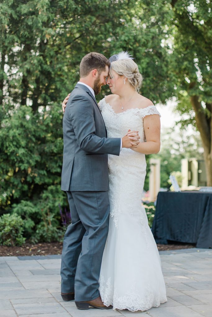 bride and groom first dance during reception at carleton golf and yacht club wedding