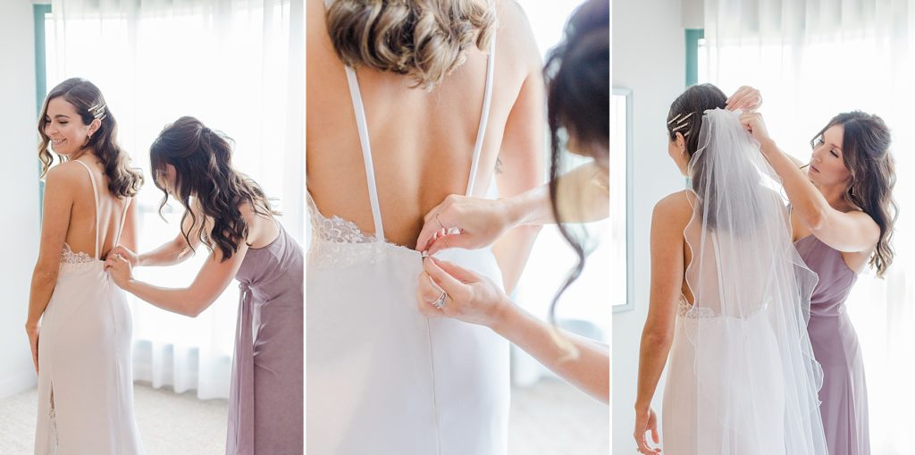 bride getting dressed with maid of honour helping her at Brookstreet Hotel in Ottawa