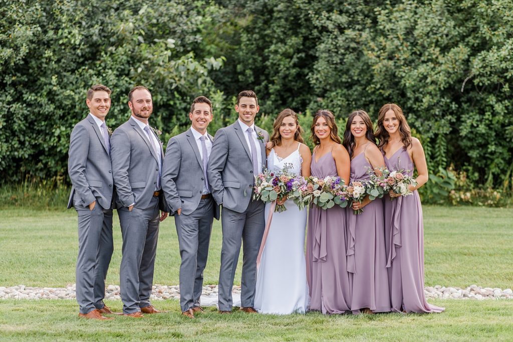 Bridal party photos wearing mauve and grey at Aquatopia Wedding