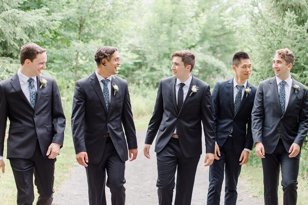 groomsmen all walking together during Ottawa wedding