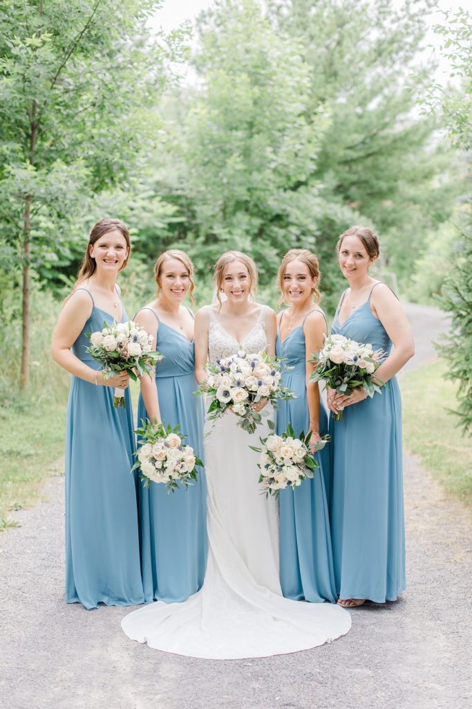 bridesmaid portraits wearing dusty blue at Brookstreet Hotel Wedding in Ottawa with Brittany Navin Photography