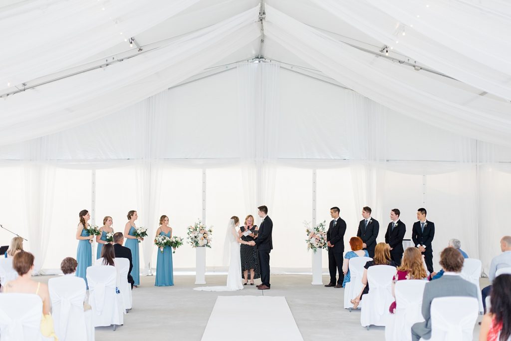 ceremony in the outdoor pavilion at Brookstreet Hotel Wedding in Ottawa with Brittany Navin Photography