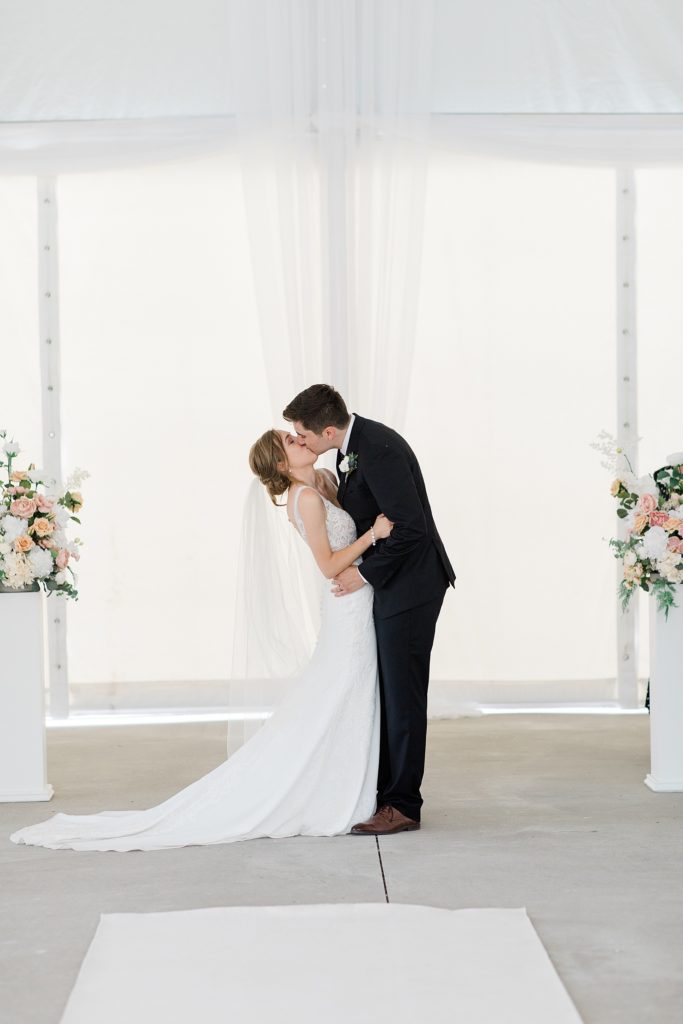 bride and grooms first kiss at Ottawa wedding 