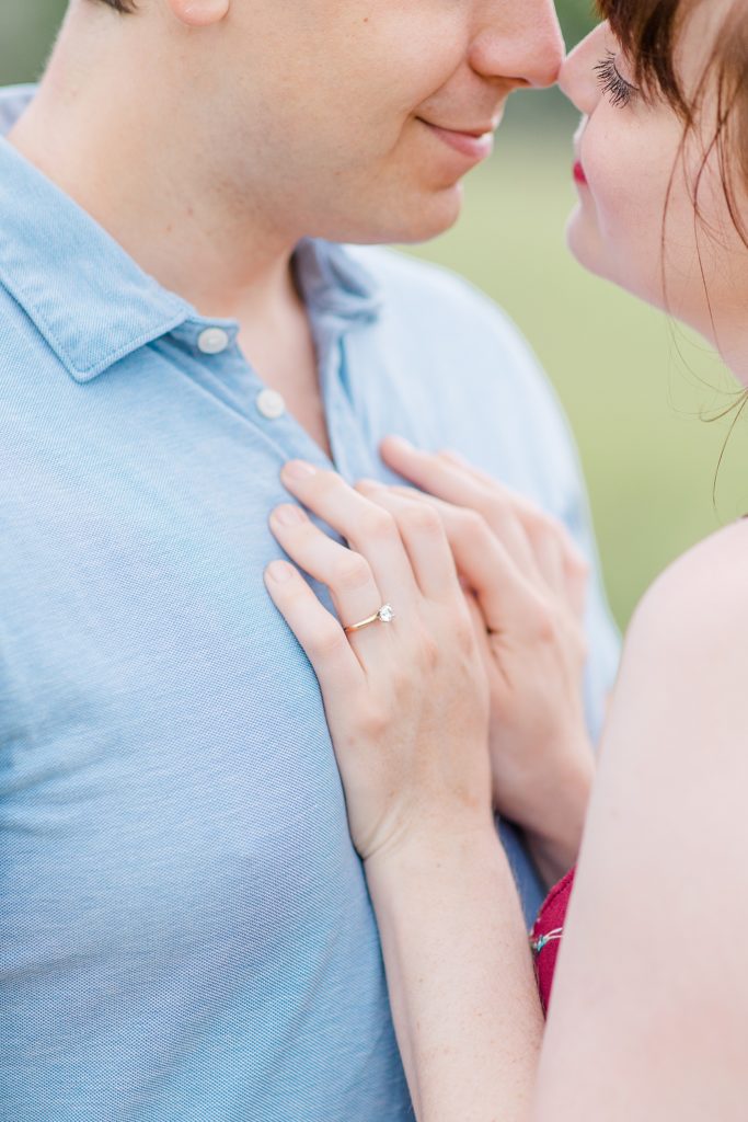 close up of her hands on his chest showcasing her engagement ring during Almonte engagement session with Brittany Navin Photography