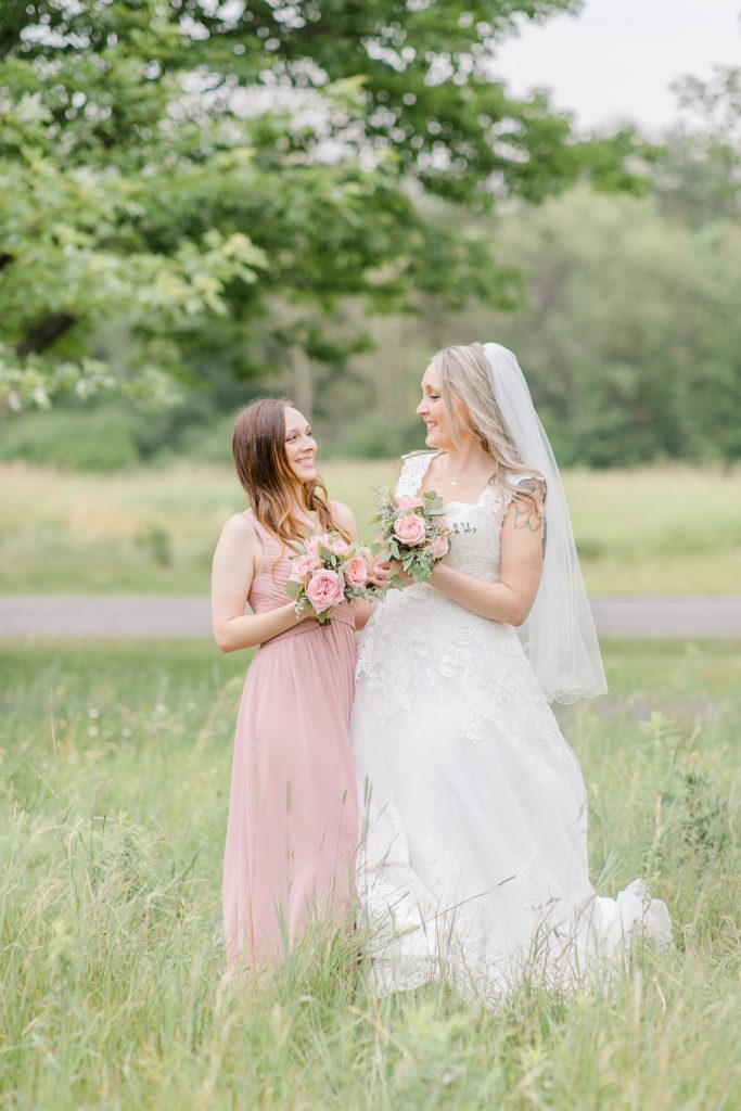 Bride and maid of honour in blush pink at Mill of Kintail Wedding with Brittany Navin Photography in Almonte, Ontario