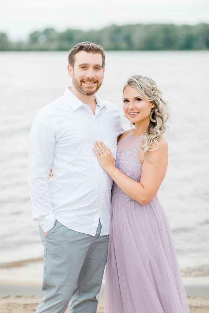 classic portrait of bride and groom to be during their engagement session at ottawa beach