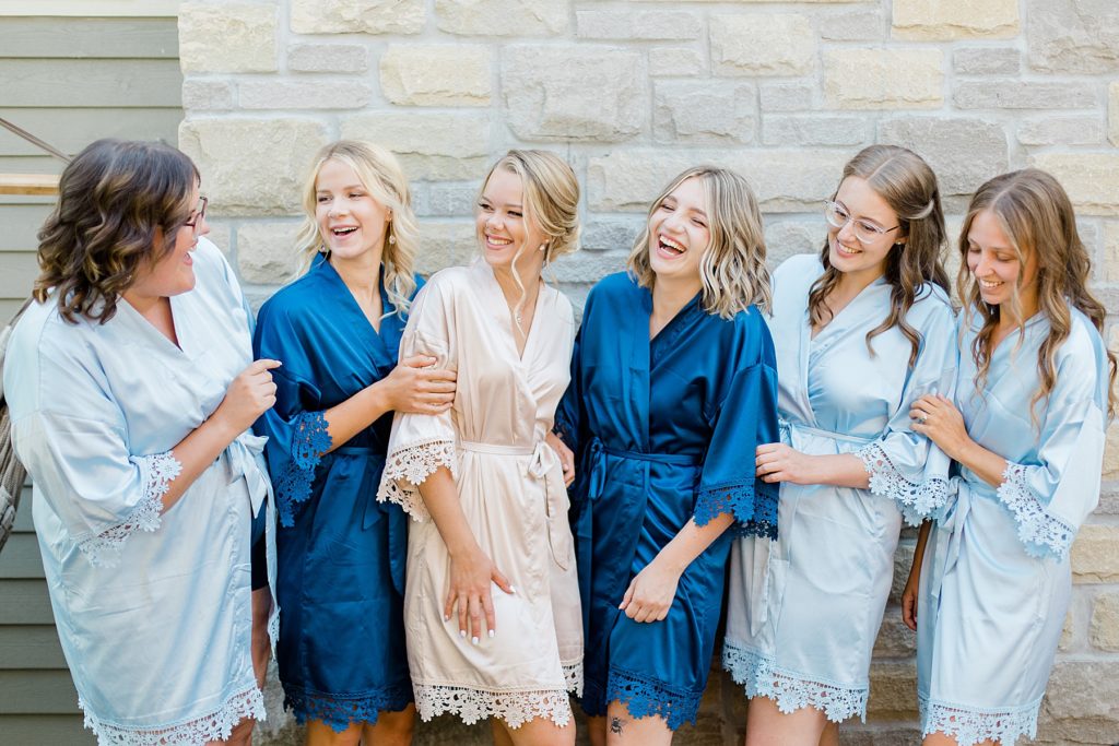 bridal party in matching blue getting ready robes at Ottawa Wedding