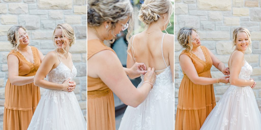 mom is helping bride get into her wedding dress at Ottawa wedding
