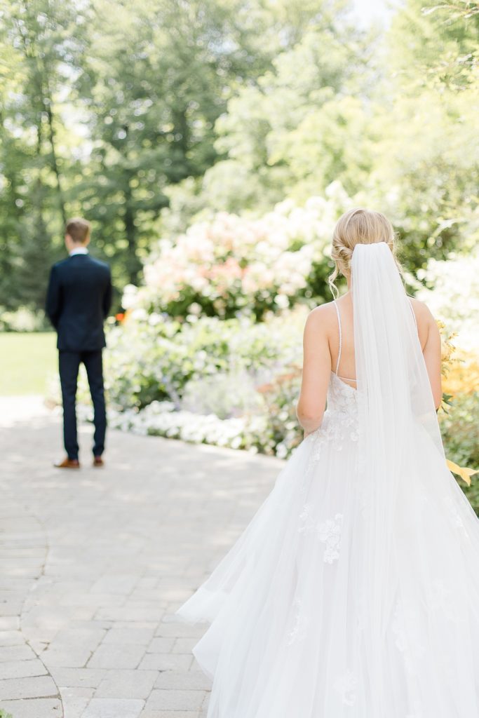 bride and groom first look at Temple's Sugar Bush Wedding Photographed by Brittany Navin