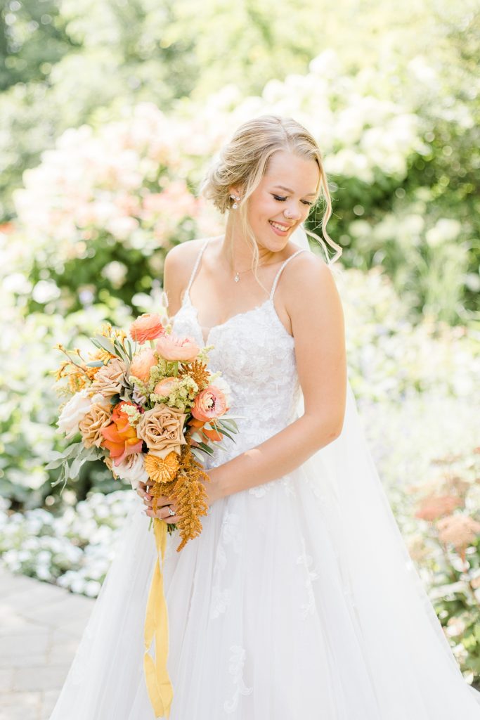 bridal portrait holding florals from pretty posey at Temple's Sugar Bush Wedding Photographed by Brittany Navin