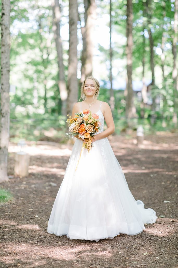 bride coming down the aisle at Temple's Sugar Bush Wedding Photographed by Brittany Navin