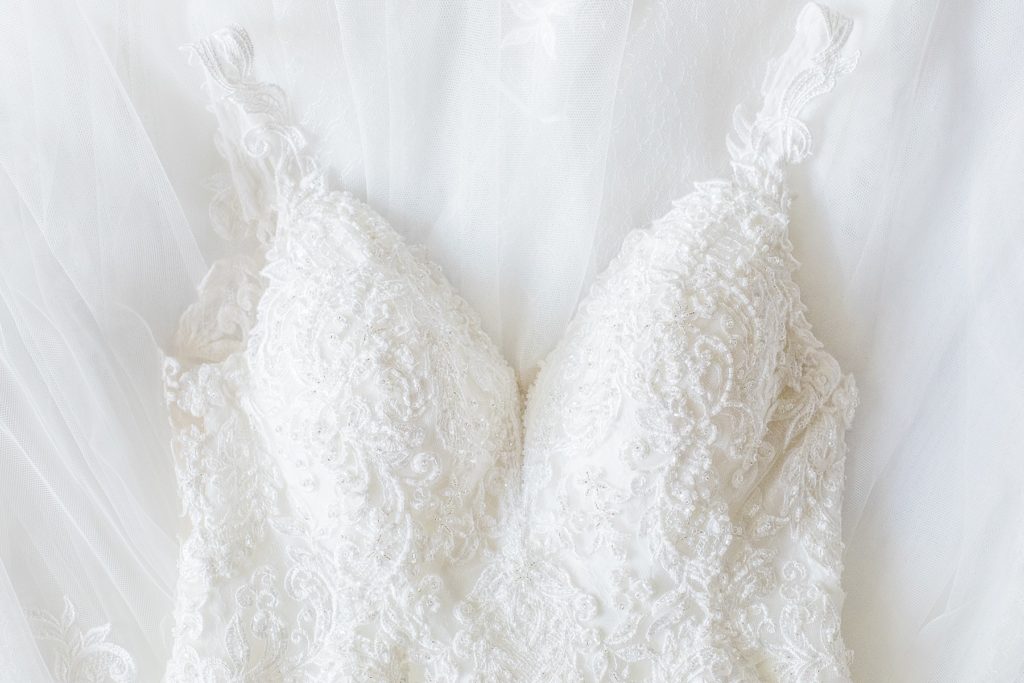 detail photo of brides dress at timber run golf course wedding in Lanark, Ontario photographed by Brittany Navin