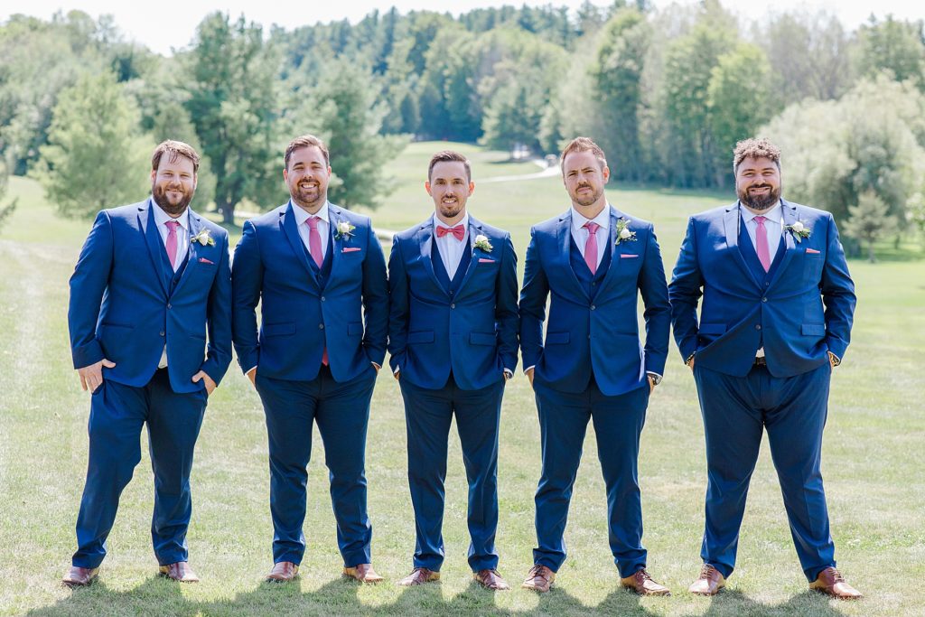 groom and groomsmen wearing navy suit and dusty rose ties at lanark wedding