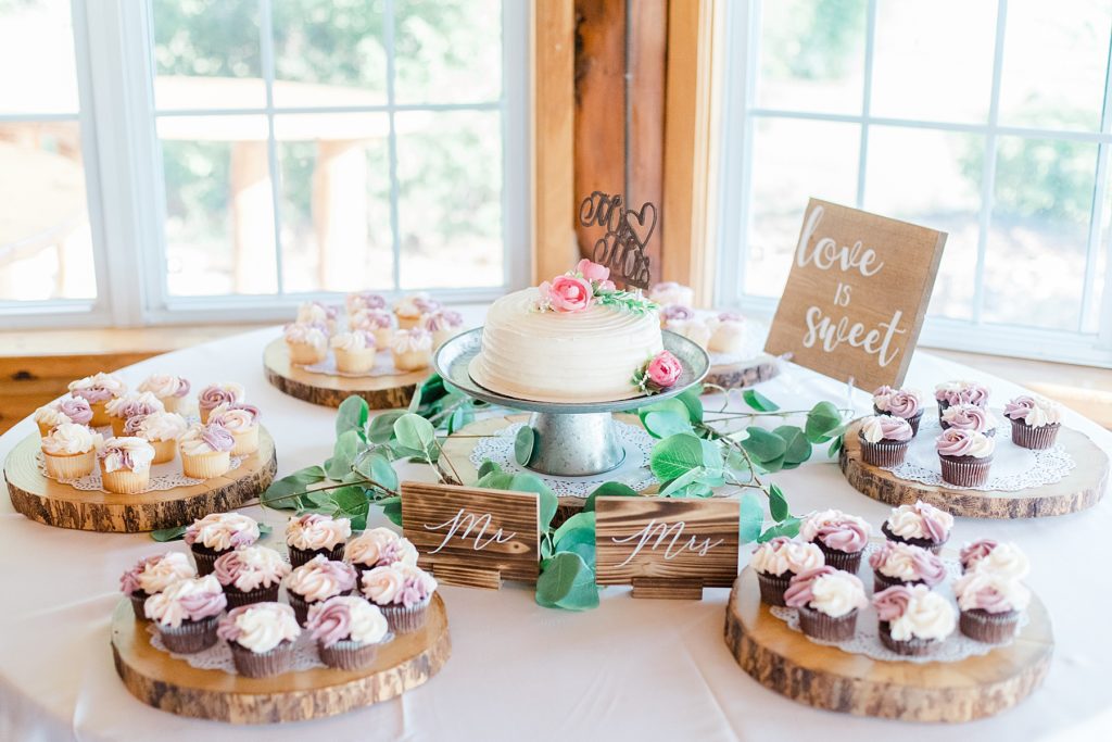 cupcakes and wedding cake at timber run golf course wedding in Lanark, Ontario photographed by Brittany Navin