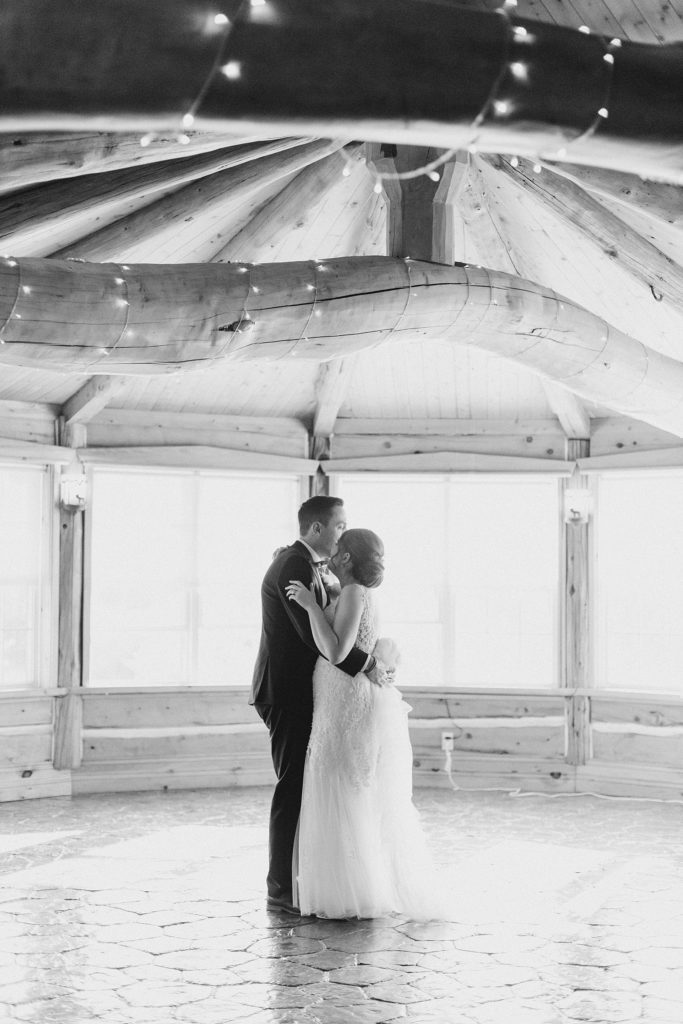 bride and groom first dance in black and white at timber run golf course wedding in Lanark, Ontario photographed by Brittany Navin
