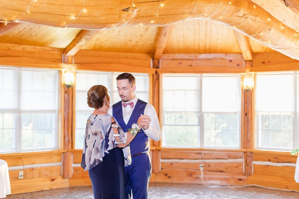 groom and mother dance at timber run golf course wedding in Lanark, Ontario photographed by Brittany Navin