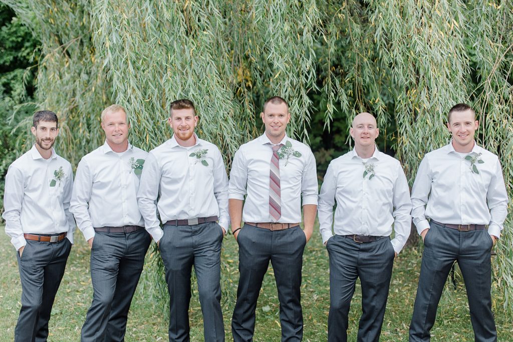 groom and groomsmen at Adelina Barn Wedding Photographed By Brittany Navin Photography