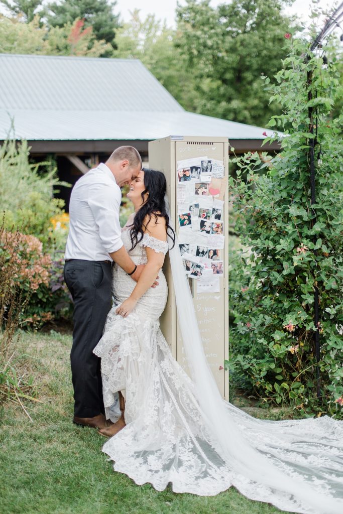 husband and wife leaning up against their highschool locker at Adelina Barn Wedding Photographed By Brittany Navin Photography