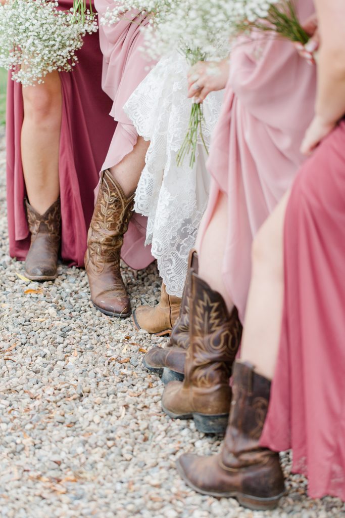 bride and bridal party showing off cowgirl boots 