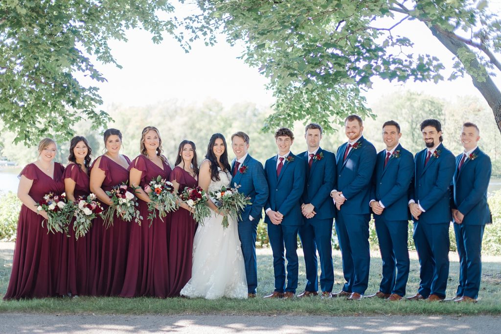 burgunday and navy bridal party colours at Riverside Park Wedding in Carleton Place photographed by Brittany Navin Photography