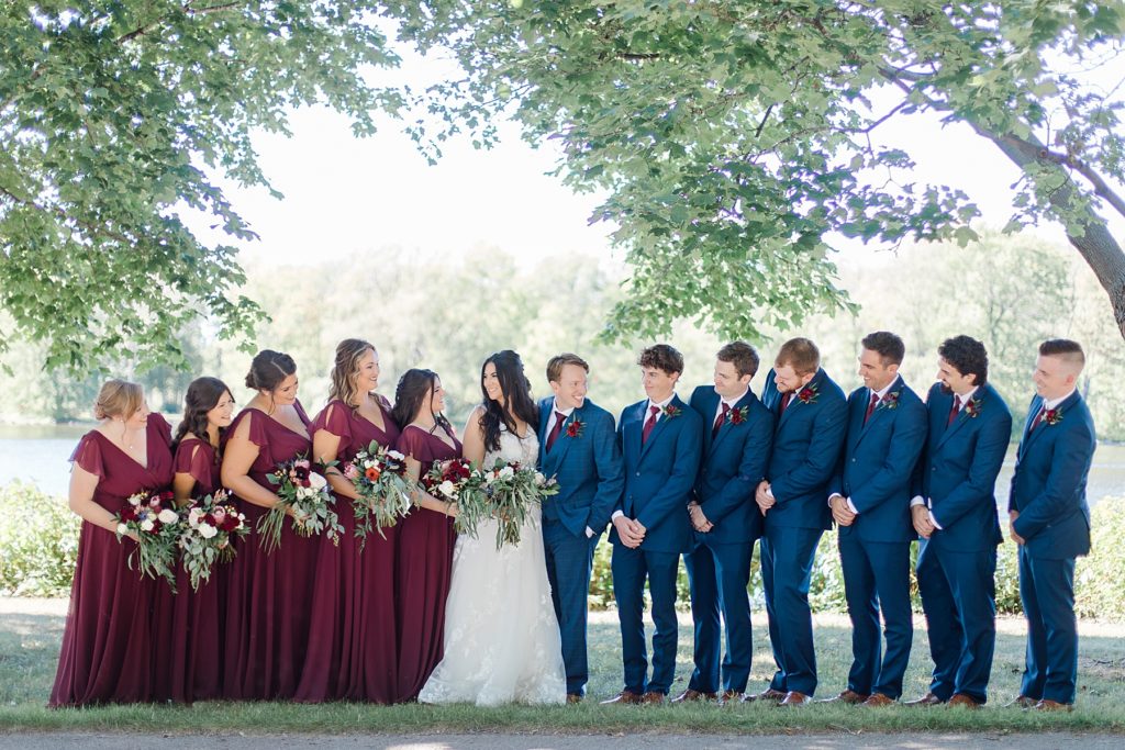 burgundy and navy wedding party colours at Riverside Park Wedding in Carleton Place photographed by Brittany Navin Photography