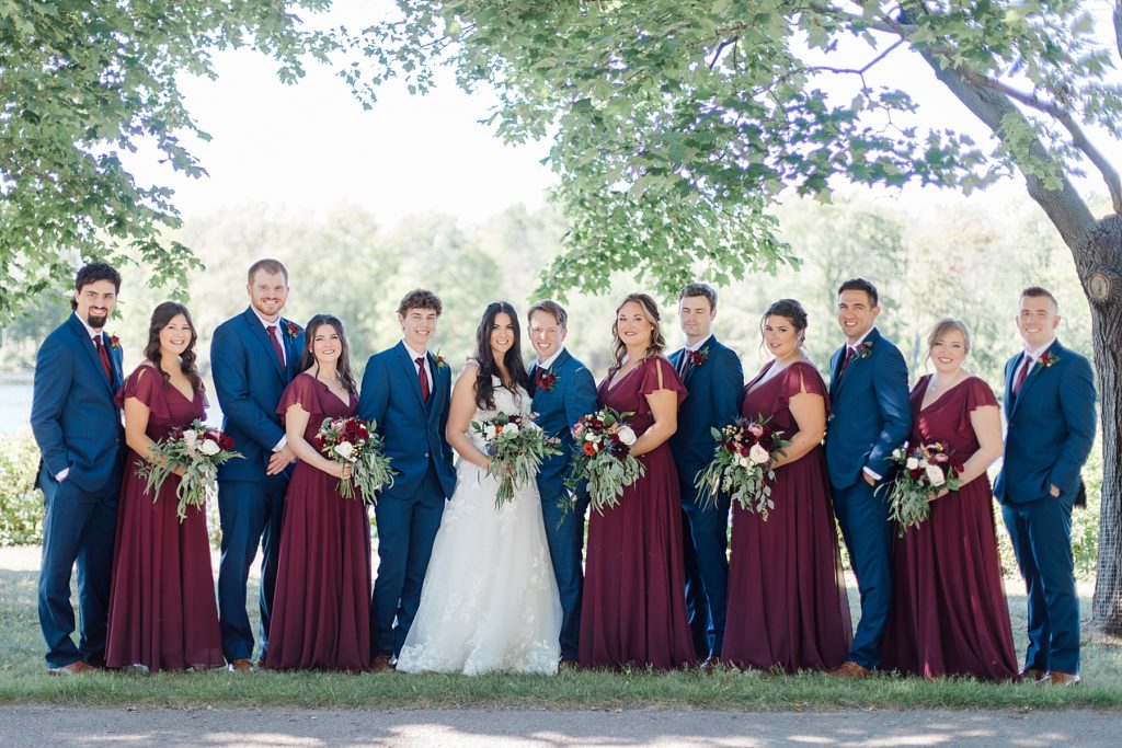 burgundy and navy bridal party colours at Riverside Park Wedding in Carleton Place photographed by Brittany Navin Photography
