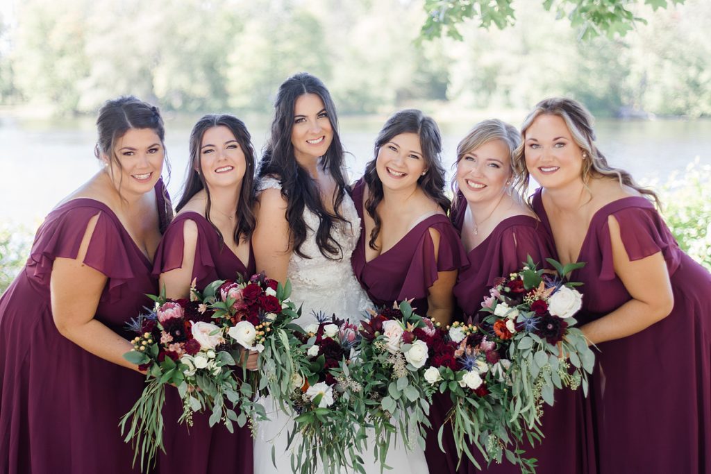 burgundy bridal party colours at Riverside Park Wedding in Carleton Place photographed by Brittany Navin Photography