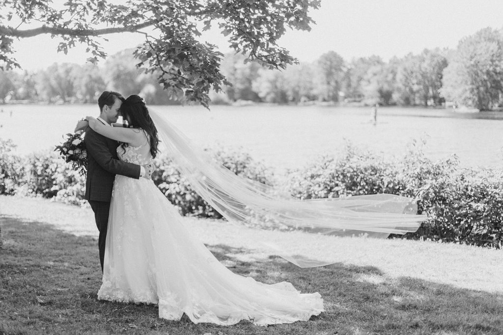 flying veil photo of bride and groom at Riverside Park Wedding in Carleton Place photographed by Brittany Navin Photography