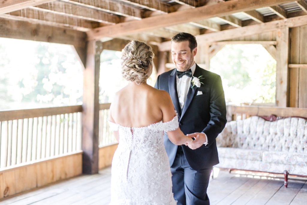 first look reaction at bean town ranch double wedding photographed by Brittany Navin Photography