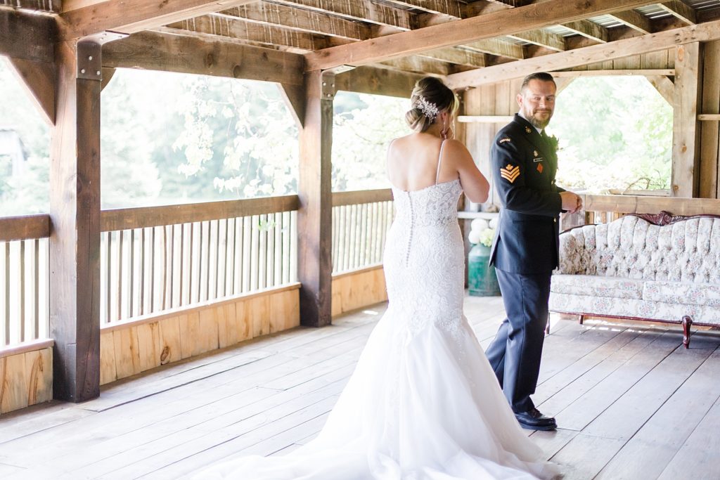 bride and groom first look at bean town ranch double wedding photographed by Brittany Navin Photography