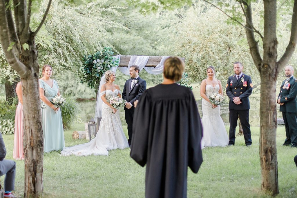 both couples at the altar at bean town ranch double wedding photographed by Brittany Navin Photography