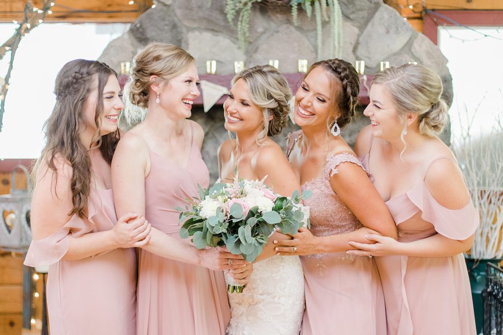 bride and bridesmaids wearing light pink at bean town ranch double wedding photographed by Brittany Navin Photography