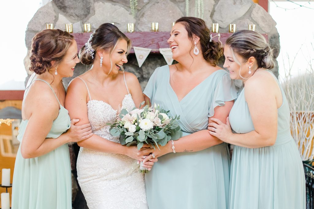 bride and bridesmaids wearing pale mint green at bean town ranch double wedding photographed by Brittany Navin Photography