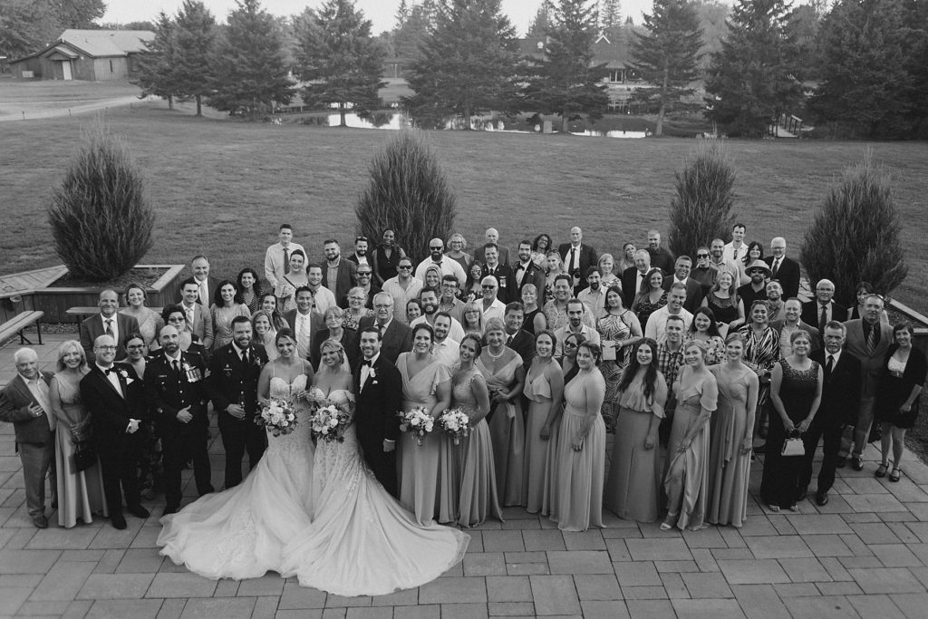 group photo at bean town ranch double wedding photographed by Brittany Navin Photography