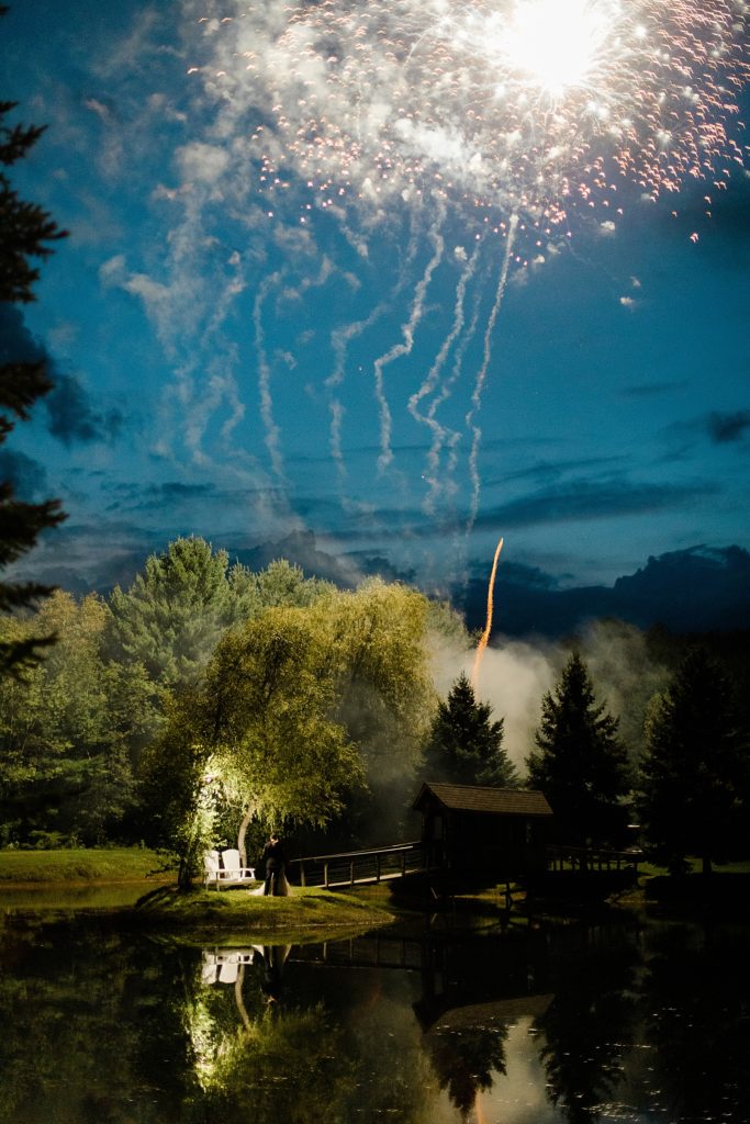 first dance under the fireworks at bean town ranch double wedding photographed by Brittany Navin Photography