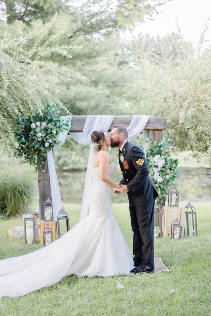 first kiss at bean town ranch double wedding photographed by Brittany Navin Photography