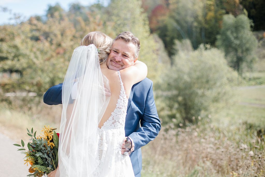father daughter first look on wedding day at Calabogie Peaks wedding photographed by Brittany Navin Photography