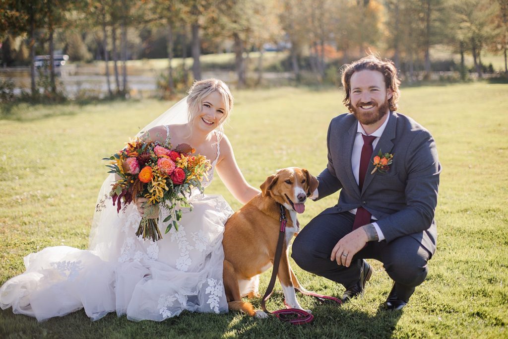 bride and groom with their dog at Calabogie Peaks wedding photographed by Brittany Navin Photography