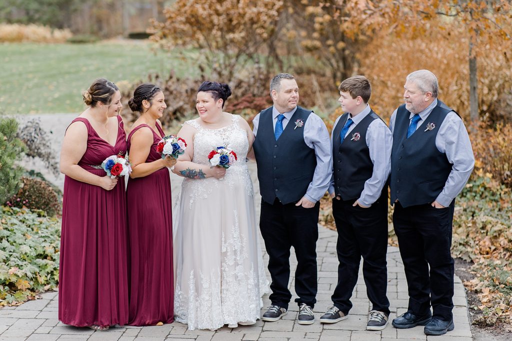 wedding party photo with burgundy and navy colours at temples sugar bush wedding photographed by Brittany Navin Photography
