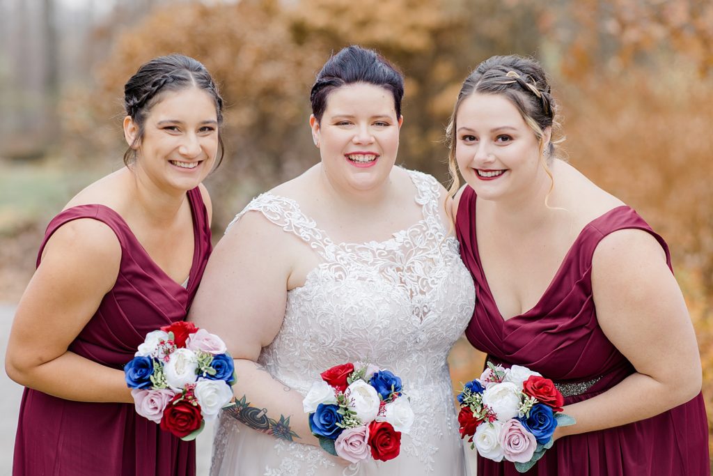 wedding party photo with burgundy and navy colours at temples sugar bush wedding photographed by Brittany Navin Photography