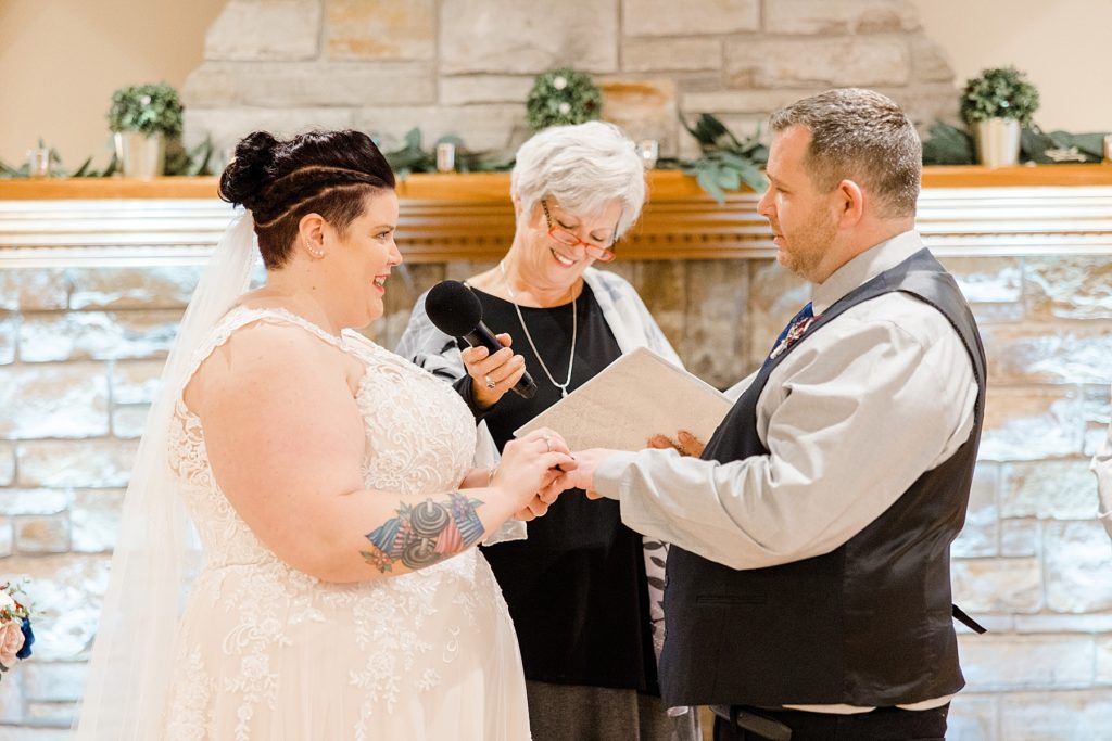 bride and groom reading vows at temples sugar bush wedding photographed by Brittany Navin Photography