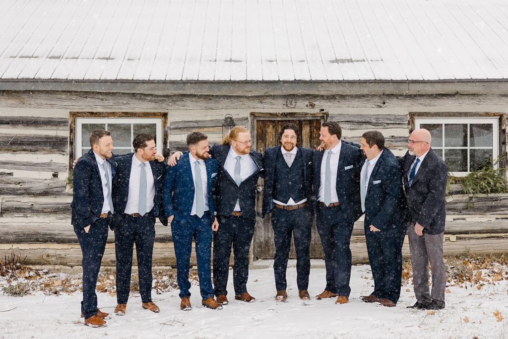 groom with groomsmen for temples country winter wedding photographed by Brittany Navin Photography